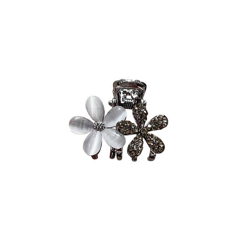 Small floral claw clip shown from an angled view for everyday styling