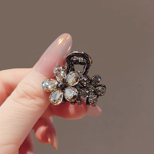 Side view of the crystal flower small hair claw clip