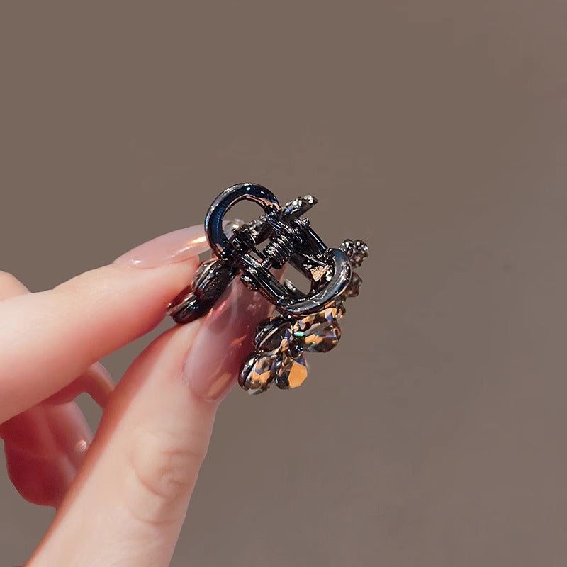 Back view of the small floral claw clip with clasp detail