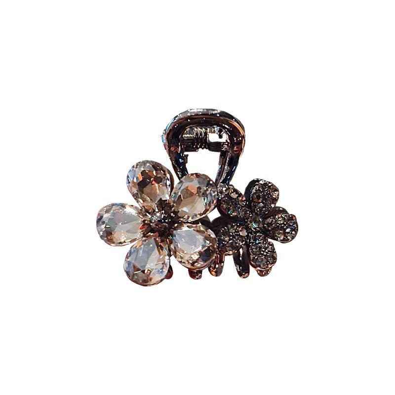 Close-up of the crystal flower design and rhinestone accents