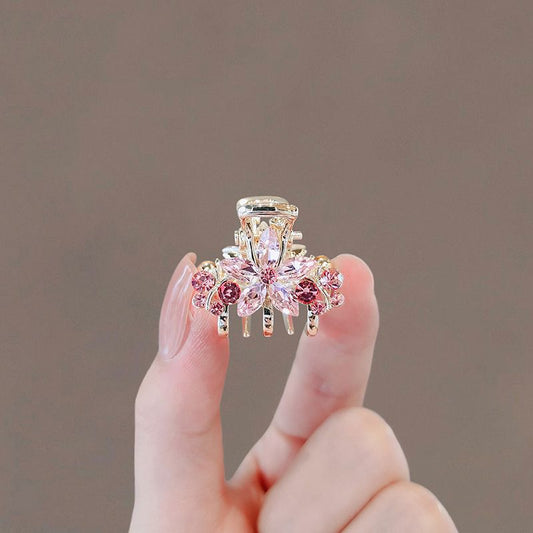 Crystal sakura mini hair claw clip shown from the front