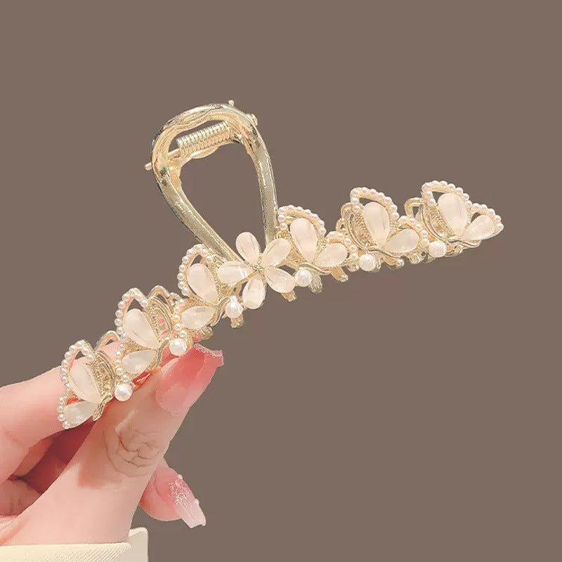 Large Gold Leaf Hair Claw Clip with Jade Flower angled view