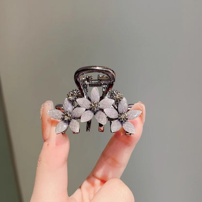 Rhinestone glass flower hair claw clip shown from the front