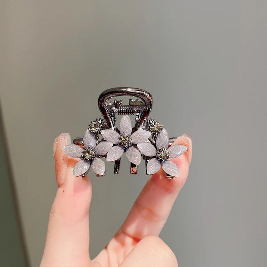 Rhinestone glass flower hair claw clip shown from the front