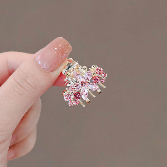 Side view of the crystal sakura mini hair claw clip