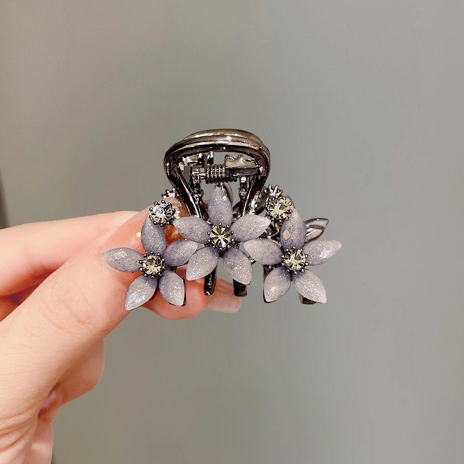 Side view of the rhinestone glass flower hair claw clip
