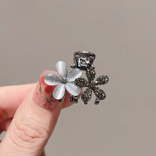 Mini flower hair claw clip with a glossy cat-eye inspired finish