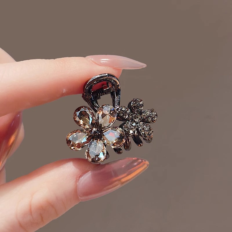 Crystal flower small claw clip shown from an angled front view