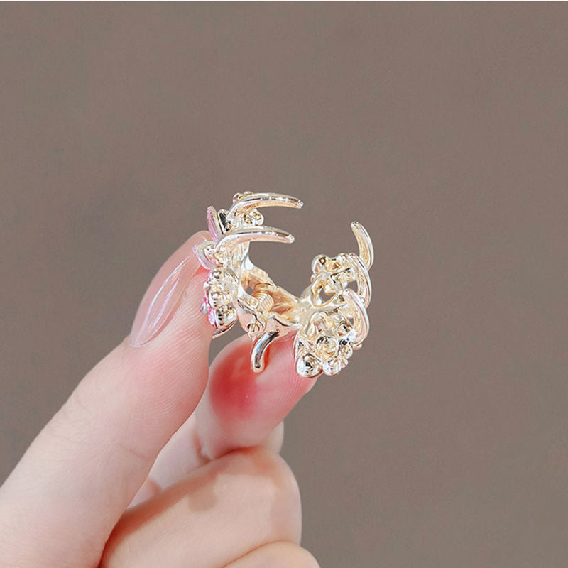 Back view of the mini floral claw clip with metal clasp