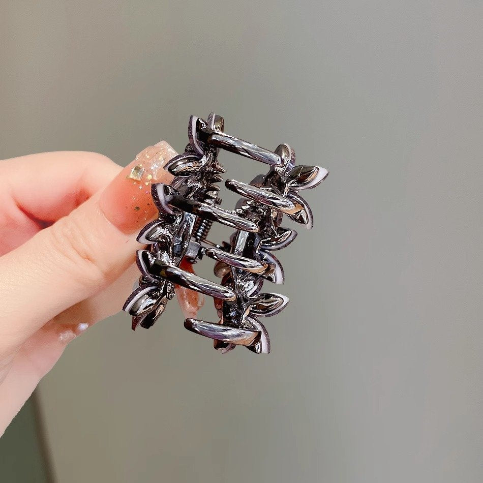 Back view of the small floral claw clip with alloy clasp