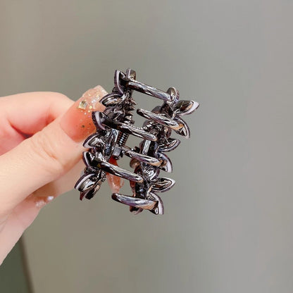 Back view of the small floral claw clip with alloy clasp