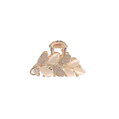 Side view of the cat-eye rhinestone leaf mini hair claw clip