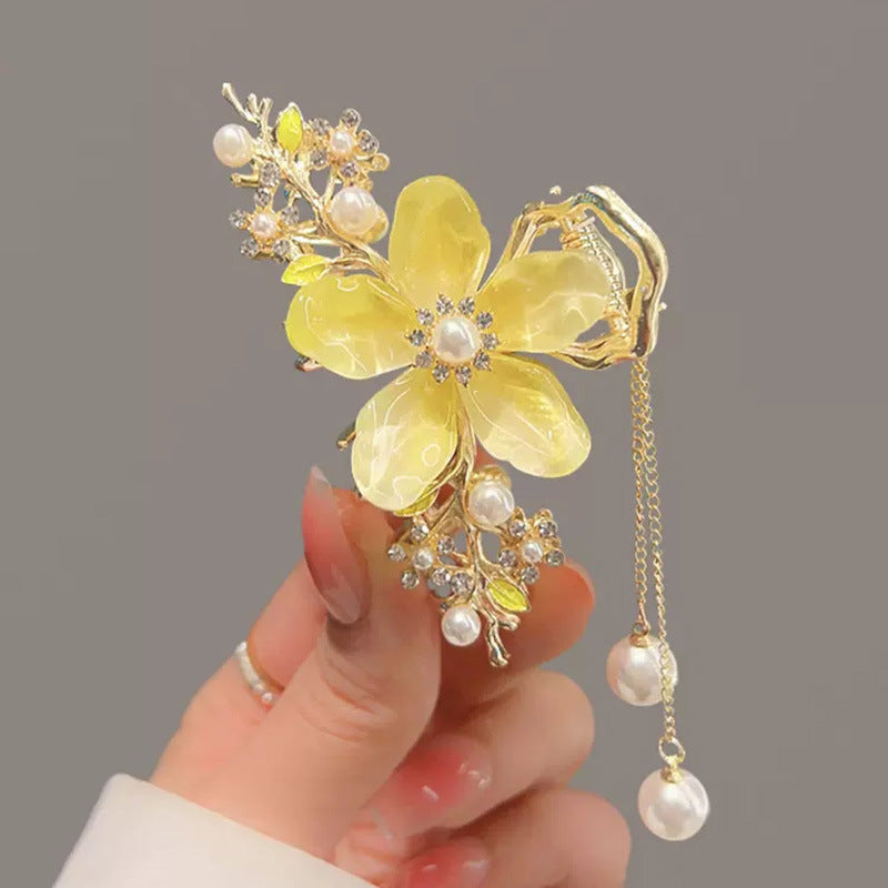 Pearl Orchid Tassel Hair Claw Clip for Half-Up Styles in hand