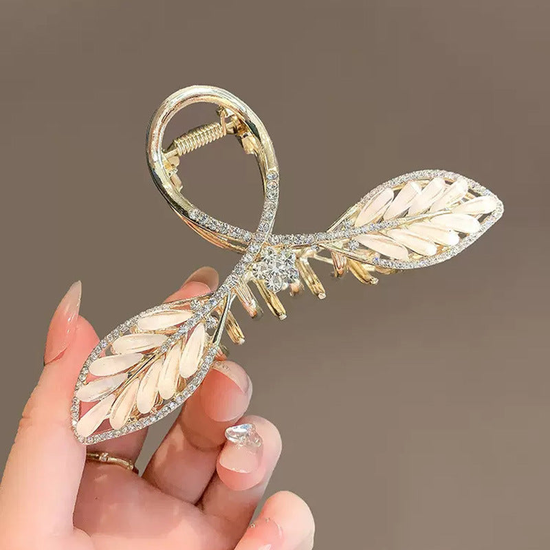 Gold Leaf Hair Claw Clip with White Inlay and Rhinestones angled view