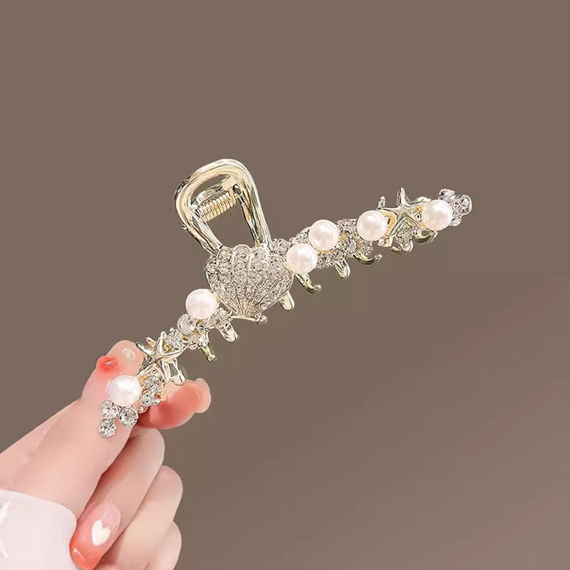 Gold Pearl Shell Starfish Hair Claw Clip in hand