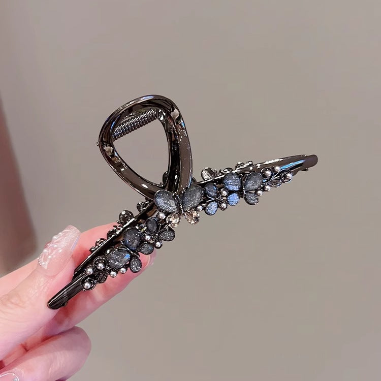 Large Black Butterfly Hair Claw Clip with Pearl Detail angled view